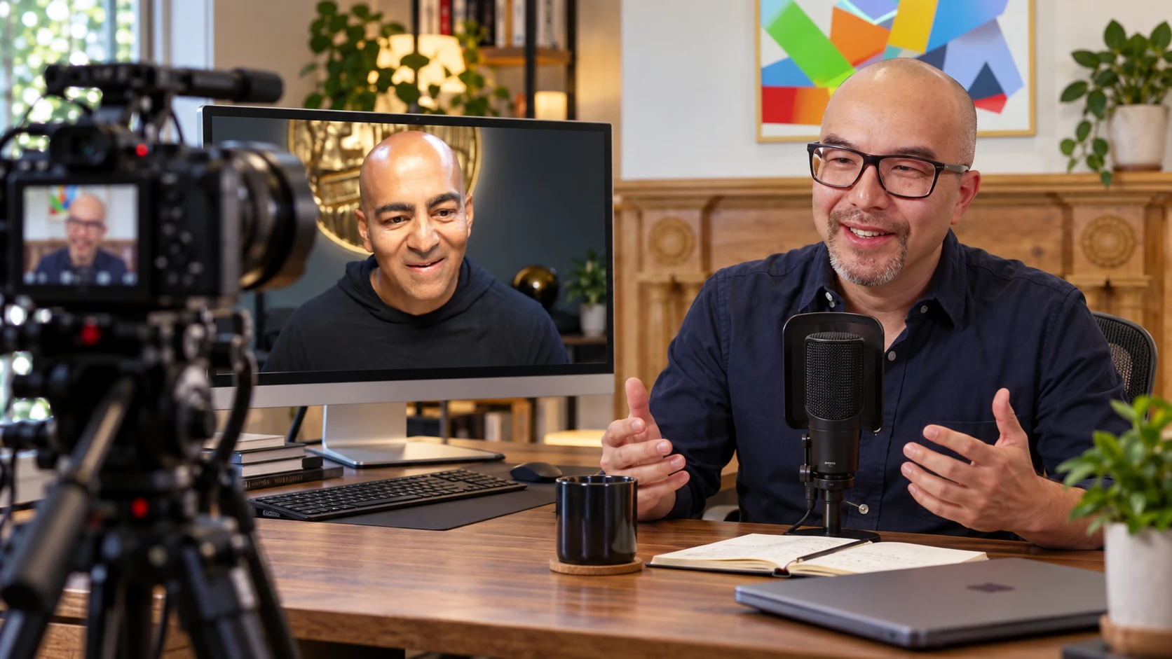 A host on the right, a remote guest on a monitor and a camera on the left